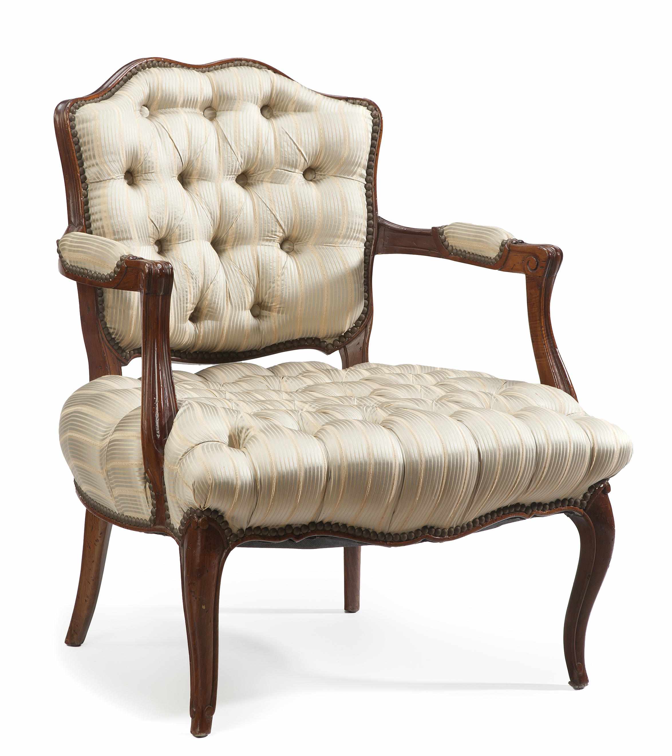 Appraisal: A Louis XV style walnut fauteuil with tufted upholstery late