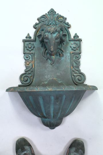 Appraisal: Cast-Iron Wall-Mounted Fountain with ram's head the backplate with a