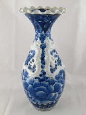 Appraisal: A Chinese ceramic blue and white moulded baluster vase with