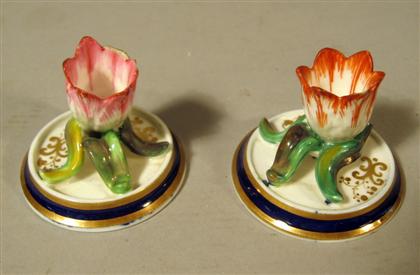 Appraisal: Pair of English tulip chambersticks Each modeled as a painted