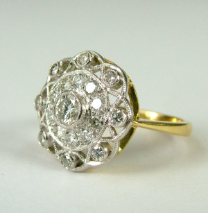 Appraisal: A Belle Epoque gold and diamond cluster ring Central brilliant