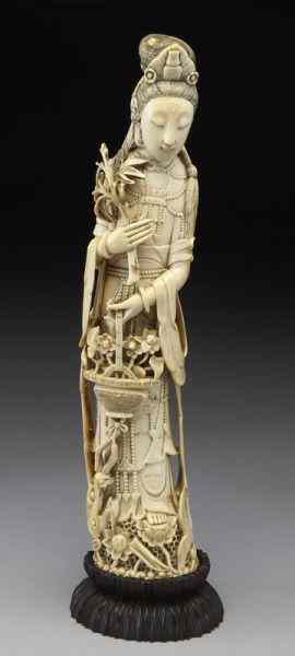 Appraisal: Chinese Qing carved ivory Guanyin holding International buyers should note