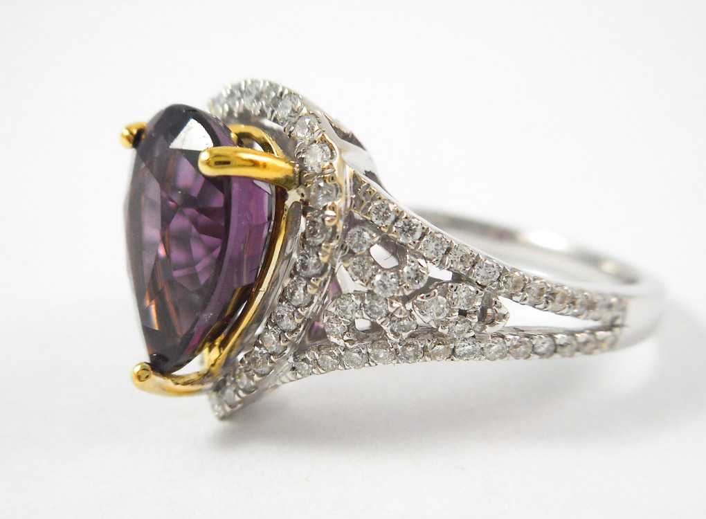 Appraisal: SPINEL DIAMOND AND FOURTEEN KARAT GOLD RING The white and