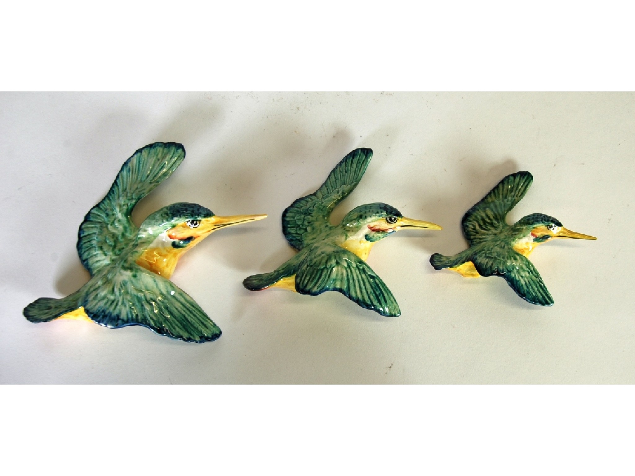 Appraisal: BESWICK POTTERY SET OF THREE GRADUATED KINGFISHER WALL ORNAMENTS the