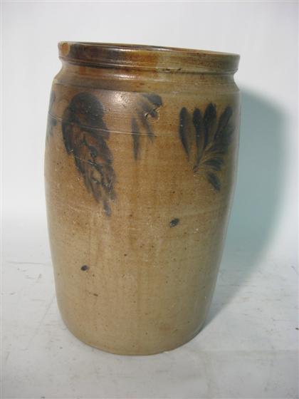 Appraisal: A tall painted stoneware crockWith a feather and palm frond