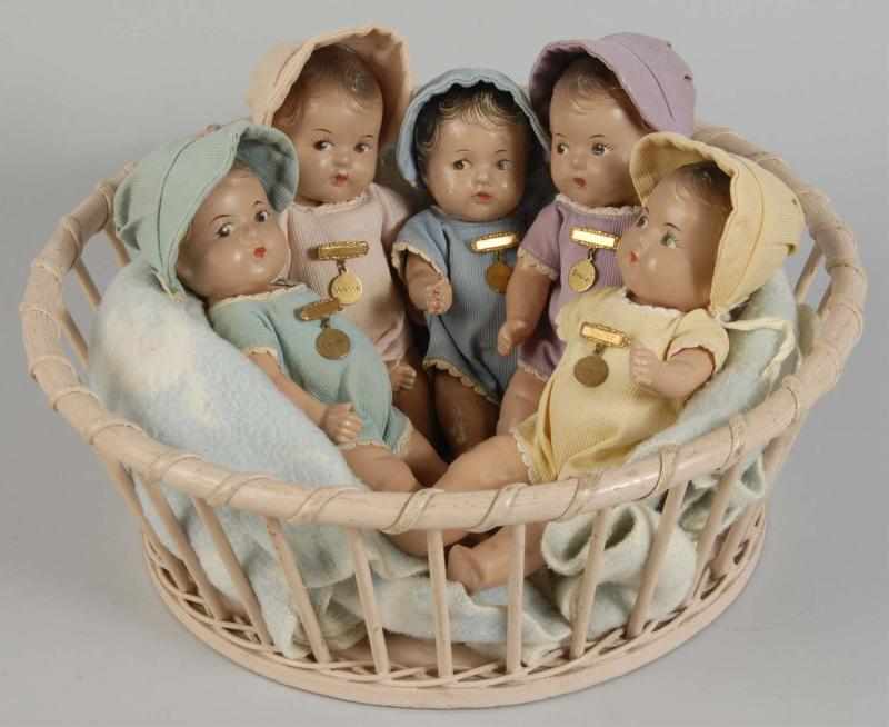 Appraisal: Madame Alexander Dionne Quintuplets in Basket Description All composition toddlers