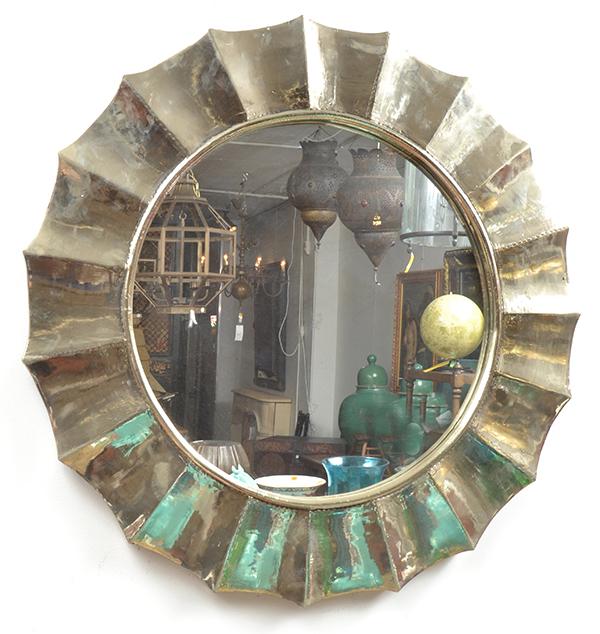 Appraisal: A PAIR OF SILVERFOIL OVERLAID MIRRORS the circular plate within