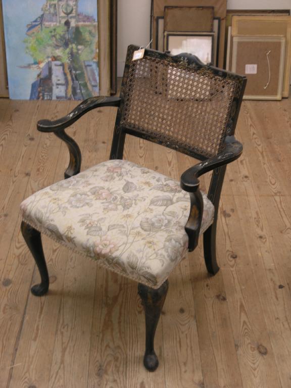 Appraisal: A chinoiserie nursing armchair gilded motifs against a black ground