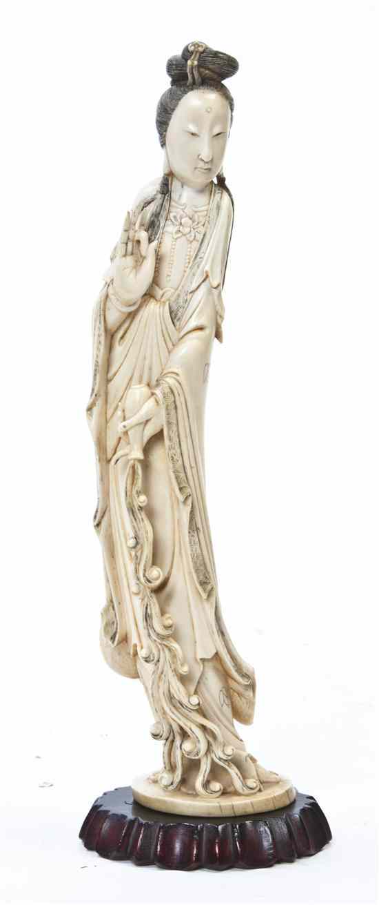 Appraisal: A Chinese Carved Ivory Figure of Guanyin the figure depicted