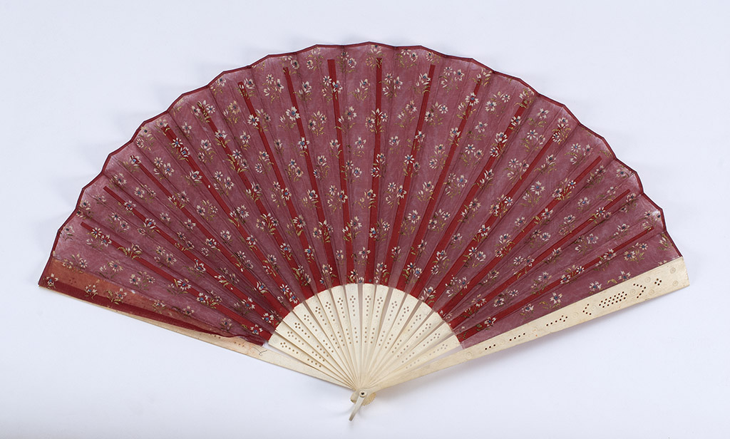 Appraisal: RED CHIFFON AND BONE FOLDING FAN Late th CenturyLeaf painted