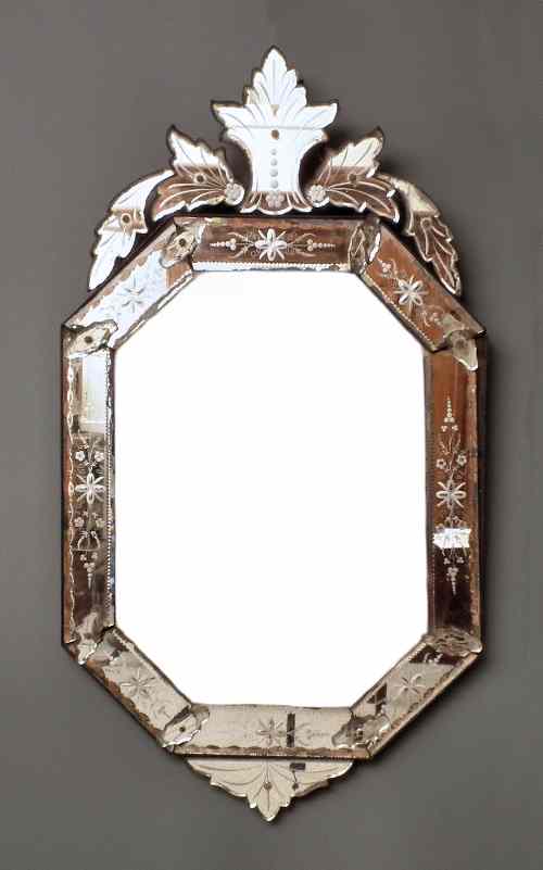 Appraisal: A Venetian style octagonal wall mirror with shaped and cut