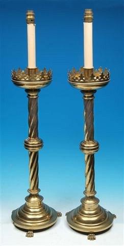 Appraisal: A PAIR OF TALL BRASS GOTHIC STYLE CANDLESTICKS converted to