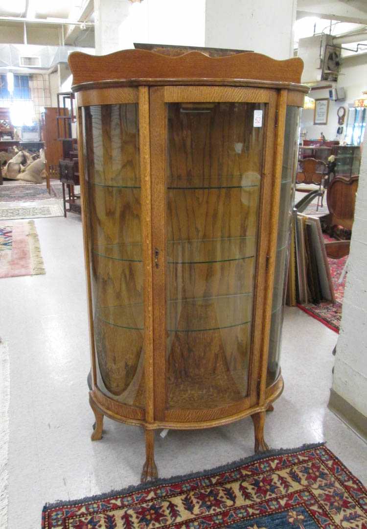 Appraisal: AN OAK AND CURVED GLASS CHINA DISPLAY CABINET American c