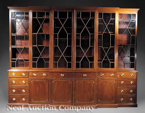 Appraisal: An Antique Georgian-Style Mahogany Breakfront Bookcase molded cornice glazed doors