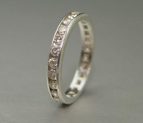 Appraisal: PLATINUM DIAMOND ETERNITY BAND round brilliant cut diamonds measure an