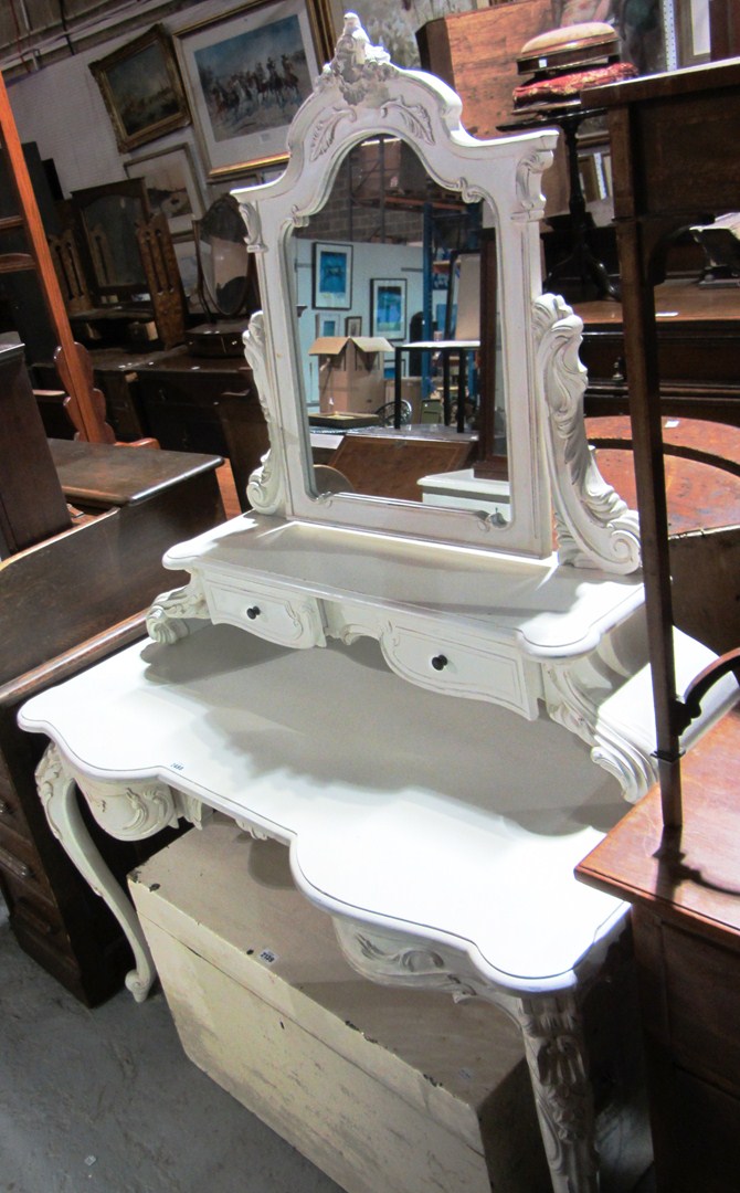 Appraisal: A th century white painted dressing table with carved decoration