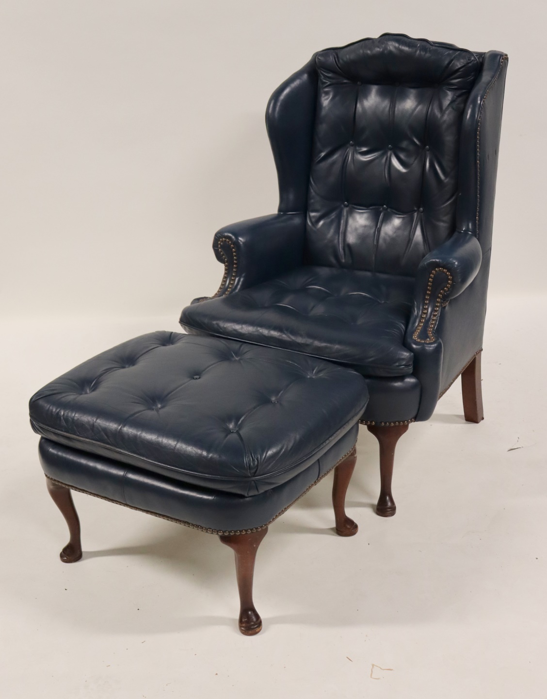 Appraisal: Q A STYLE LEATHER WING CHAIR OTTOMAN Great quality Nice