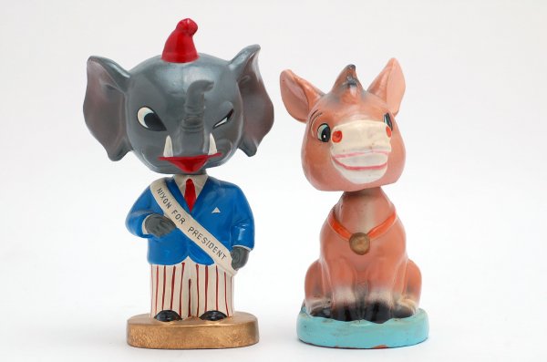 Appraisal: Smiling donkey bobblehead atop a circular aqua base and an