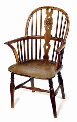 Appraisal: A th century child's yew-wood Windsor armchair with a pierced