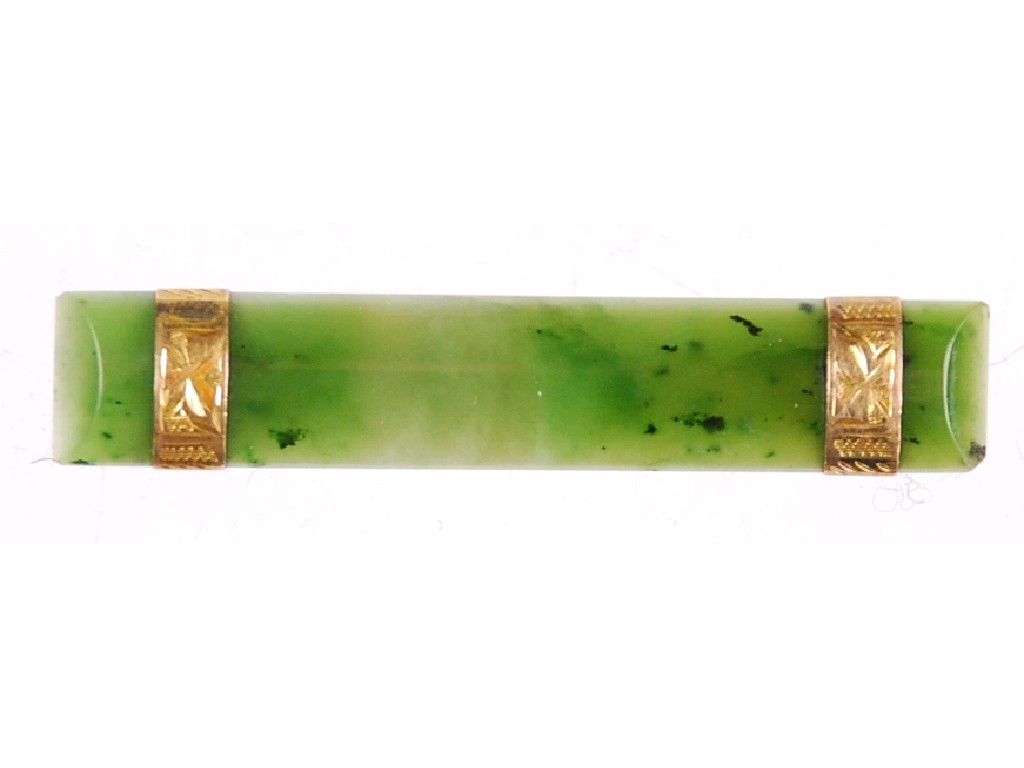 Appraisal: GREEN JADE CONVEX BAR BROOCH with two engraved gold bands