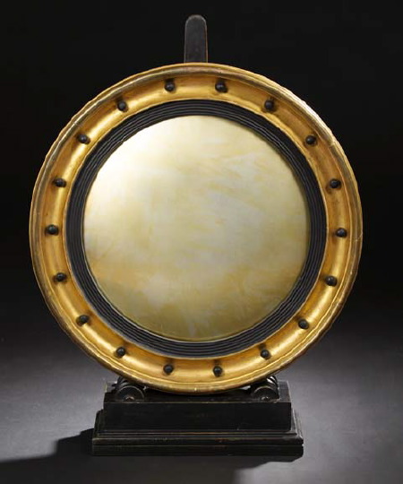 Appraisal: English Regency Carved and Parcel-Ebonized Giltwood Convex Looking Glass first