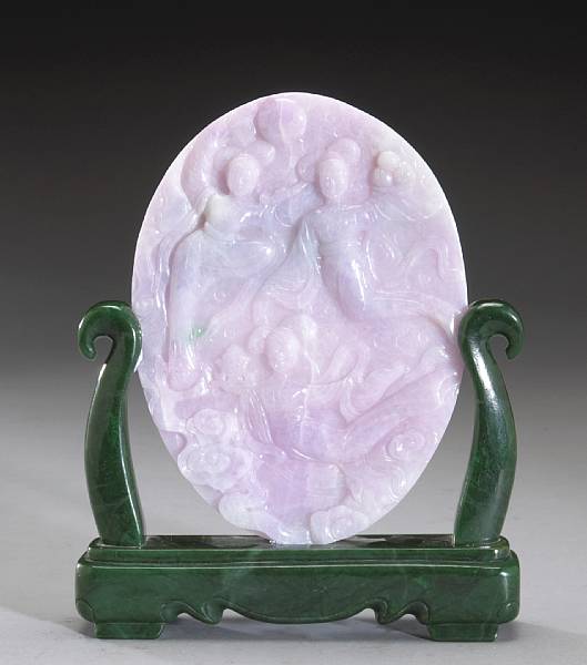 Appraisal: A lavender jadeite oval plaque on a green jade stand