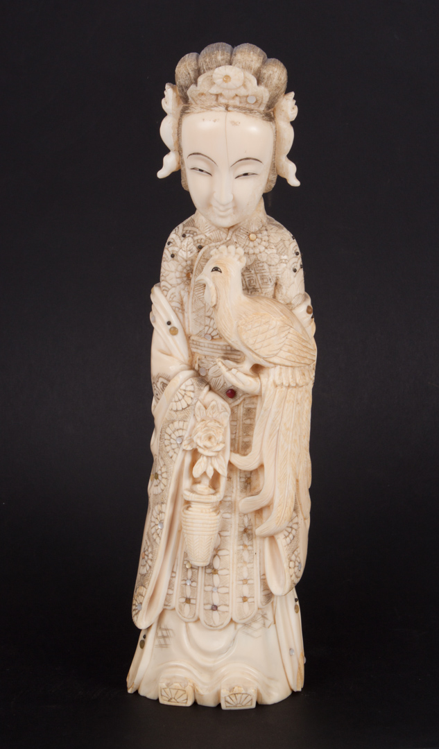 Appraisal: Japanese carved ivory empress female in regal attire holding phoenix