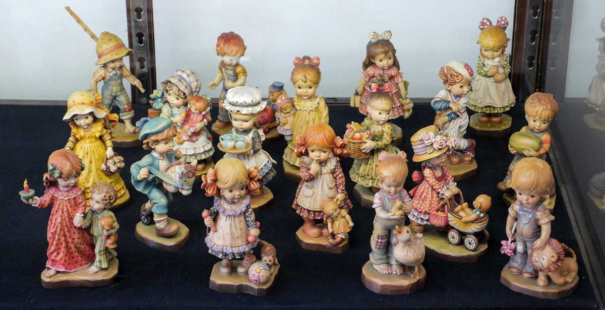 Appraisal: SARAH KAY ANRI ITALIAN CARVED WOOD FIGURINES An assembled collection