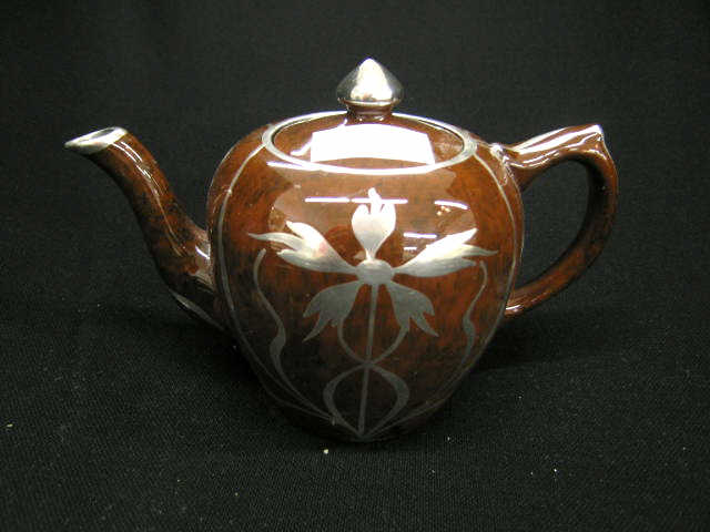 Appraisal: Silver Overlay Porcelain Teapot floral on brown