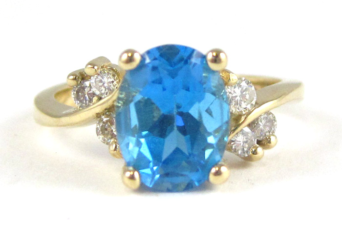 Appraisal: BLUE TOPAZ DIAMOND AND FOURTEEN KARAT GOLD RING with three