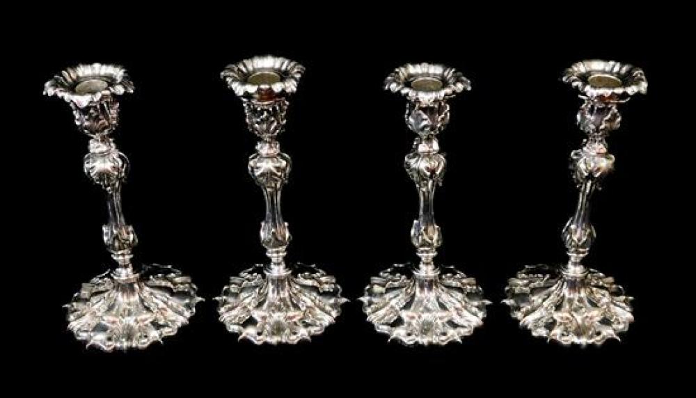 Appraisal: SILVER Four ornate Elkington Co Birmingham England silver plated candlesticks