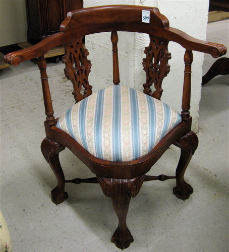 Appraisal: CHIPPENDALE STYLE MAHOGANY CORNER ARMCHAIR with bow arms over carved