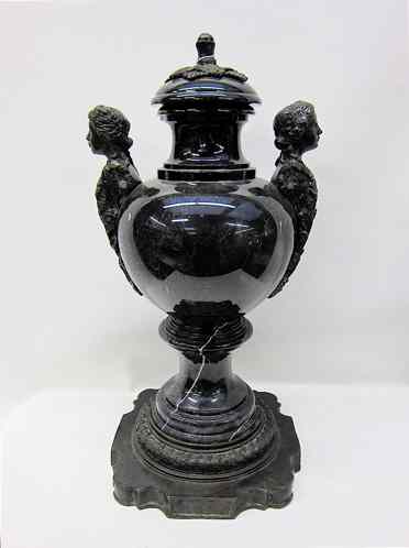 Appraisal: MARBLE AND BRONZE COVERED URN featuring a footed black Porfido