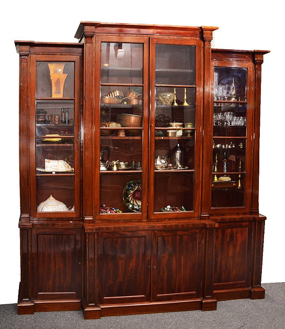 Appraisal: th Century mahogany breakfront library bookcasethe upper fitted adjustable shelves