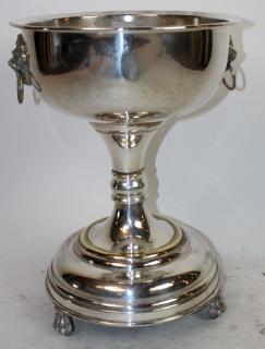 Appraisal: French Silverplate footed champagne bucket on paw feet with lion