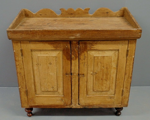 Appraisal: Pine dry sink mid th c with a carved backsplash