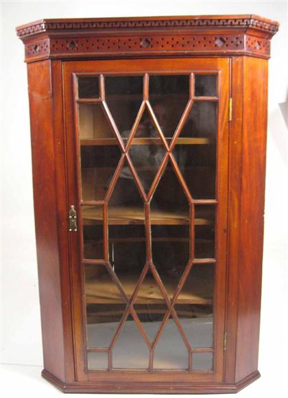 Appraisal: George III mahogany hanging corner cupboard With a Greek key