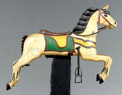 Appraisal: Wooden carousel horse carved and caparisoned galloping horse shield at