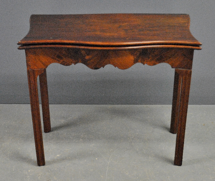 Appraisal: - Georgian mahogany card table with a flip top secret