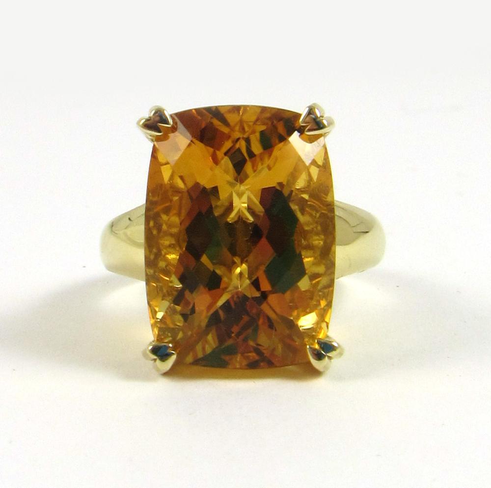 Appraisal: CITRINE AND FOURTEEN KARAT GOLD SOLITAIRE RING with yellow gold