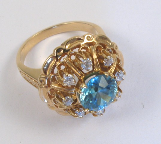 Appraisal: ZIRCON AND DIAMOND RING k yellow gold and centering a