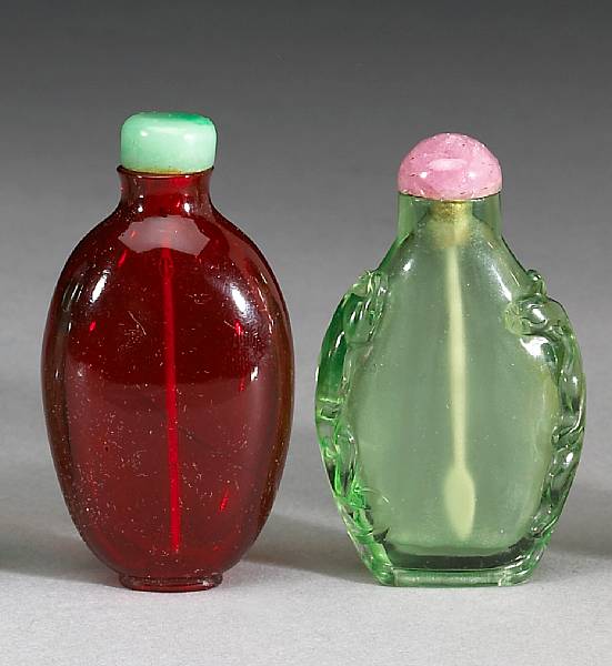 Appraisal: Two Peking glass snuff bottles th Century The first of