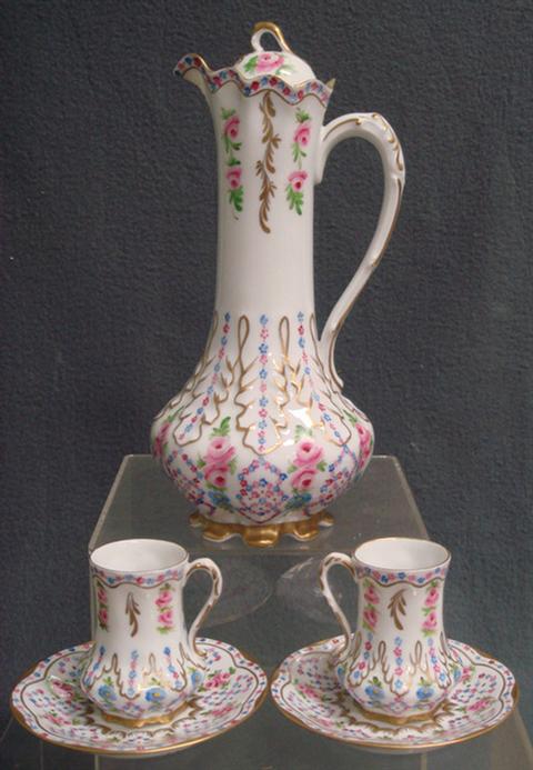 Appraisal: Floral decorated Giraud Limoges porcelain chocolate pot with cups and