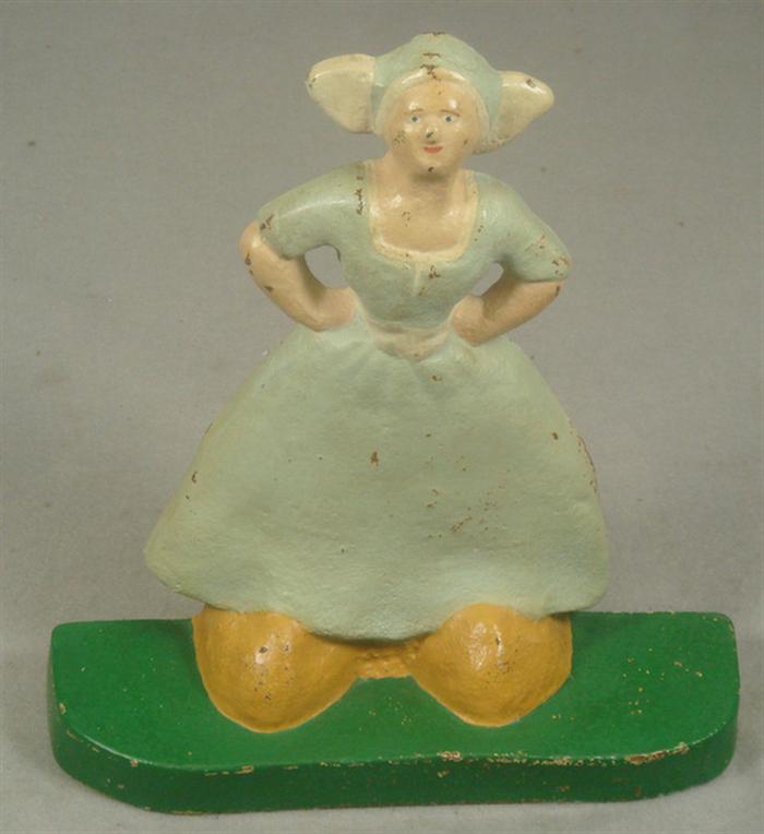 Appraisal: Cast iron doorstop Dutch woman in dress on green base