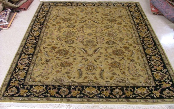 Appraisal: ORIENTAL INDO-PERSIAN CARPET floral design across a rectangular yellow-green ground