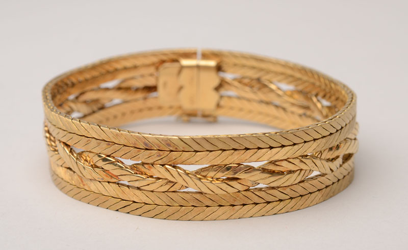 Appraisal: RETRO K BRAIDED YELLOW GOLD BRACELET Stamped ' kt Italy'