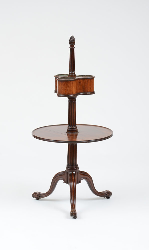 Appraisal: GEORGE III MAHOGANY BOTTLE TABLE The pinecone finial above the