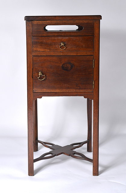 Appraisal: A George III mahogany washstandwith recessed top and drawers and