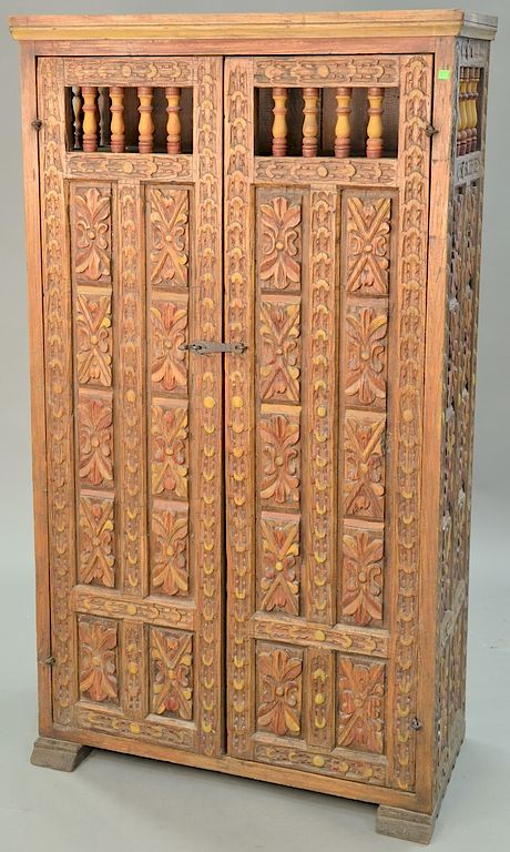 Appraisal: Carved two door cabinet ht in wd in Carved two