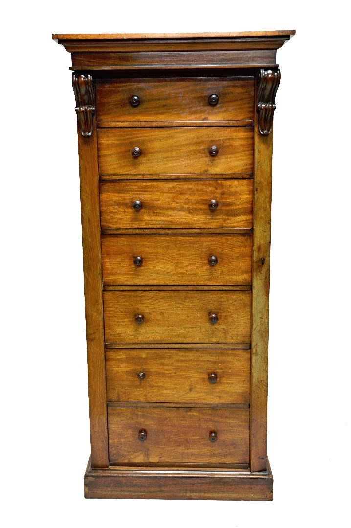 Appraisal: A large Victorian mahogany Wellington chest of seven graduated drawers